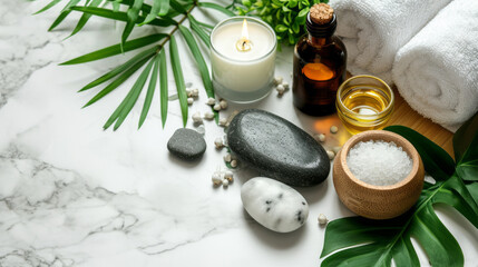 Fototapeta na wymiar Beauty treatment items for spa procedures on white wooden table and marble wall. massage stones, essential oils and sea salt. candle, rolled up white towel