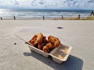 Dutch fish snack called Kippeling at the North Sea beach