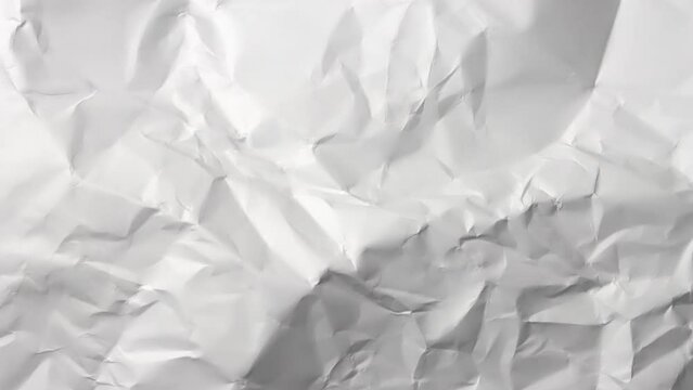 Time-lapse of rapidly changing texture of a white crumpled paper