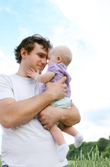 Happy young father with little daughter