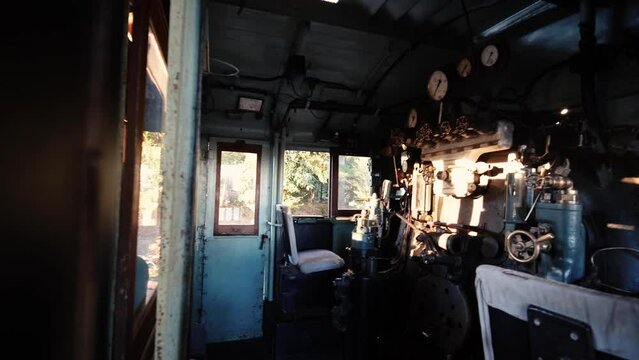 Control room, dashboard panel with lever and switches. Old train cockpit operator cabin. 