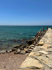 Fototapeta na wymiar Steps overlooking the Mediterranean, Playa dels Pilons, Salou, Costa Derada, Spain, 2023