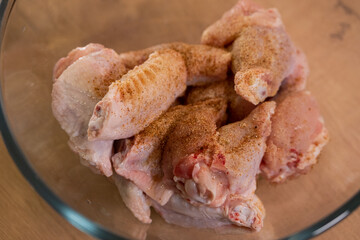 Raw chicken wings in spices. Preparation of ingredients. Healthy diet food