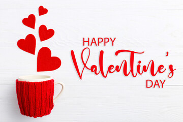 Red hearts coming out of the cup on white background. Concept of Women's Valentine's Day.