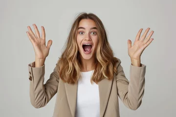 Foto op Plexiglas Photo studio shot of a stylish young businesswoman hand rise and yelling, looking very glad and surprised. The background is clean, solid white background. © radekcho