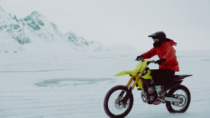 Obraz na płótnie Canvas Winter motocross. Racers ride on ice. Winter sports.
