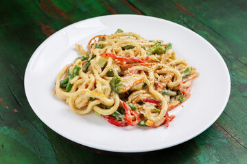 Wok noodles, noodles with vegetables, beans, broccoli, carrots and peppers in sauce. Vegetarian.