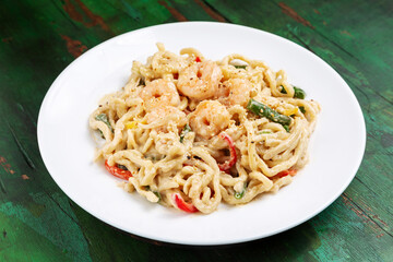 Wok noodles, noodles with shrimp, beans and pepper in sauce.