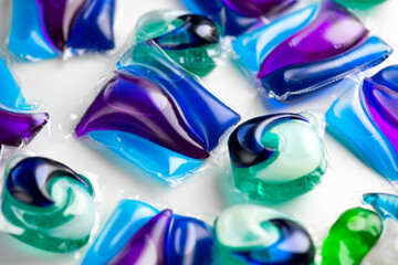 Washing capsules, colorful laundry pods. Colorful Soluble capsules with laundry gel detergent and dishwasher soap. Pile of various washing pod capsules. Detergent tablets. Top View, Flat Lay.  - 716455663