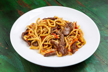 Wok noodles, noodles with Beef, carrots and peppers in teriyaki sauce.