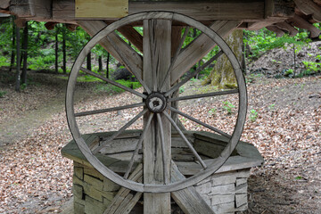 Fototapeta premium old wooden well with a wheel.