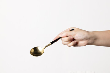 hand hold fork and spoon in white background isolated