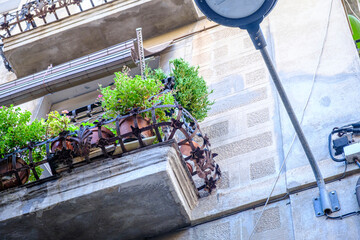 Detail of a wrought iron balcony, of modernist design on a street in Barcelona (SPAIN)