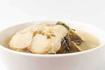 Cod soup on a white background