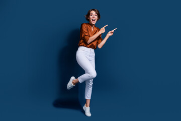 Full body photo of attractive young woman point excited empty space wear trendy brown blouse...