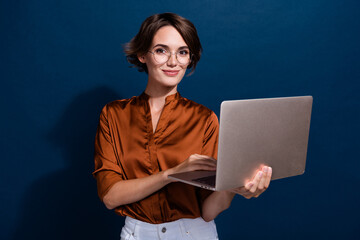 Photo portrait of attractive young woman hold netbook working remotely dressed stylish brown blouse...
