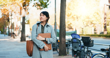 Thinking, city and Japanese business woman with ideas for morning commute, journey and travel to...