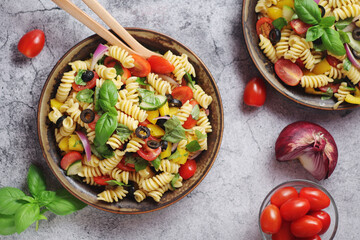 A bowl with traditional Italian pasta salad