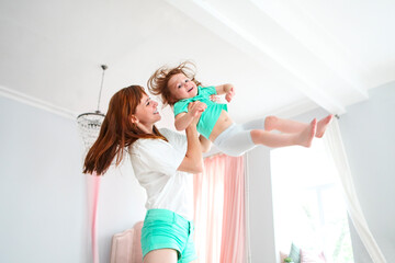 Young woman having fun with daughter