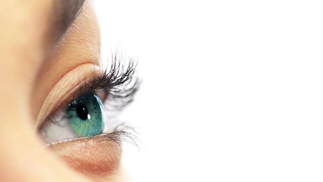 Lens, closeup and eye of person thinking, vision and blinking pupil isolated on a white studio background. Face macro, natural and eyeball of model, eyelashes or green iris for beauty mockup space