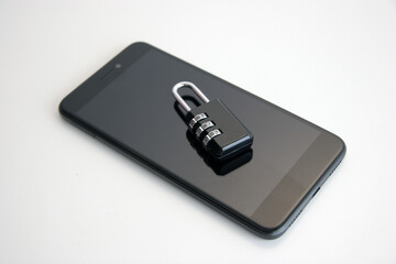 Smartphone with combination padlock. Mobile security concept.