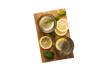 Healthy breakfast or morning with chia seeds lemon and mint on table background, vegetarian food, diet and health concept. Chia pudding with lemon and mint
