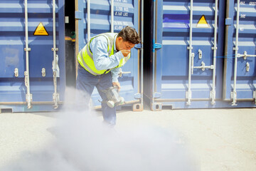 Male worker was about inspect the container holding chemical ammonia protection mask felt stink and felt dizzy because inhaled toxic fumes chemicals that were toxic to the respiratory 