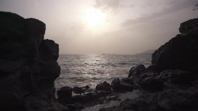 Beach with rocks at sunset in Cameroon, Africa
