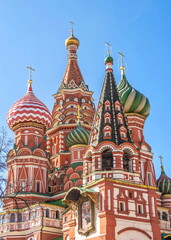 Fototapeta na wymiar Bright elegant domes of St. Basil's Cathedral (Pokrovsky Cathedral) in Moscow