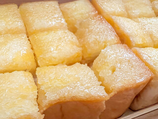 Closeup and crop Toast with butter and sugar, cut into squares for easy eating.