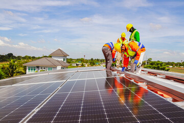 Team engineers electricians technician work team on the rooftop industrial plant installing solar...