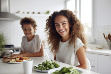 Warm mother-daughter moment in a bright kitchen, with healthy food on the table, both smiling and enjoying each other’s company