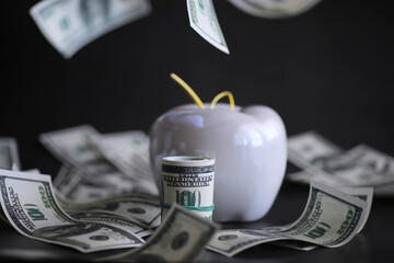Apple on table with money, dollars banknotes. Us business concept. New york big apple.