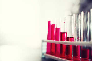 Microscopic examination of blood. Test tubes with red liquid on the laboratory table.