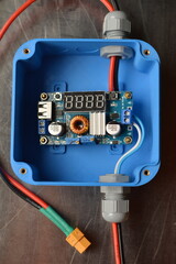 Electrical junction box with charging module inside