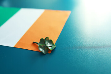 Saint patrick's day background with ireland flag. Religious Christian holiday. Four-leaf clover...