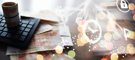 Russian rubles are on the table next to the computer, Notepad in the office or Bank. Savings and...