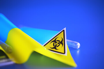 Ukrainian flag biohazard and test tubes. Assistance to Ukraine in biolaboratories. Western...