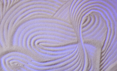 Fototapeta na wymiar Abstract semolina background with curved stripes.