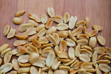 Peanut on brown wooden background.