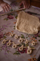 Cook's hands kneading dough for cakes. Preparing the flour for leavening