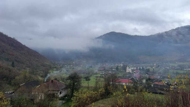 Ukraine, Carpathian fog in the mountains moves quickly with accelerated time lapse filming. wet whirlwinds run along the slopes, cars on the road