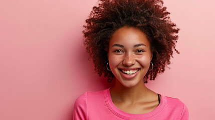 Radiant Joy: Full Portrait of a Laughing African American Woman in Colorful Pink Attire, Photography Illuminating Vibrant and Optimistic Spirit Against a Light Pink Background