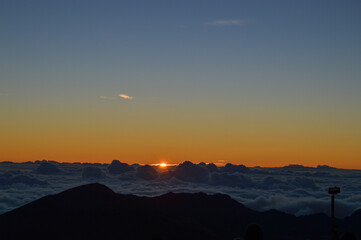 Sunrise Above the Clouds on Volcanic Landscape
