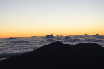 Sunrise Above the Clouds on Volcanic Landscape

