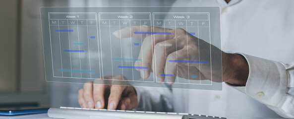 Businessman use calendar for appointments and organize agenda. Planning events on virtual screen.