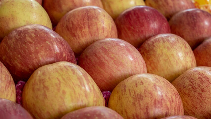 range of fuji apples in a supermarket