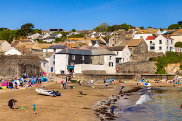  Gorran Haven, Roseland Peninsula, Cornwall, UK - Families play on the beach and in the sea at Gorran Haven on a beautiful sunny spring day.