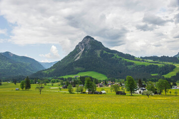 Summer austrian landscape with green meadows and impressive mountains, view from small alpine village Tauplitz, Styria region, Austria