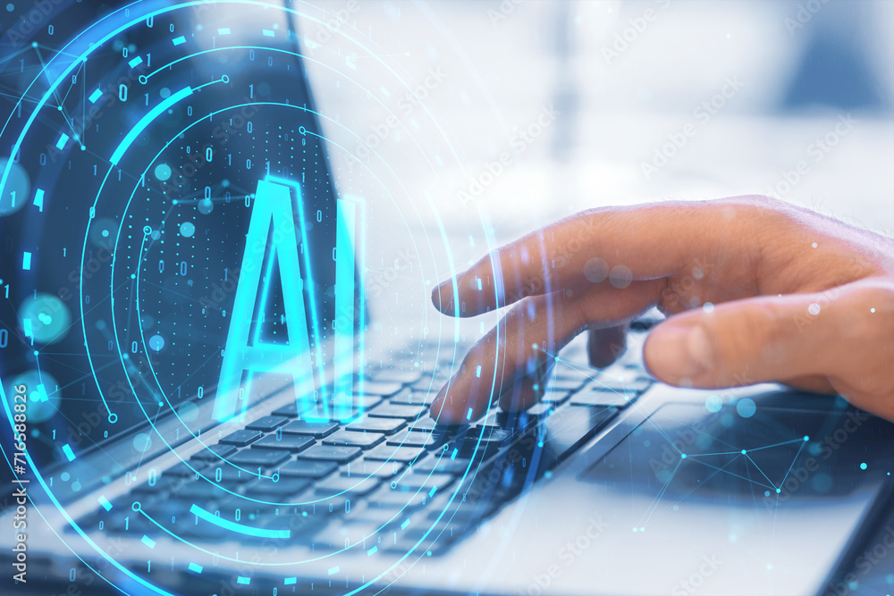 Aufkleber Close up of male hand using laptop keyboard on desk with glowing round AI hologram on blurry background. Artificial intelligence and machine learning concept. Double exposure.